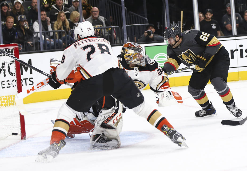 Golden Knights right wing Alex Tuch (89) gets the puck past Anaheim Ducks goaltender John Gibson (36) to score a goal during the first period of an NHL hockey game at T-Mobile Arena in Las Vegas o ...