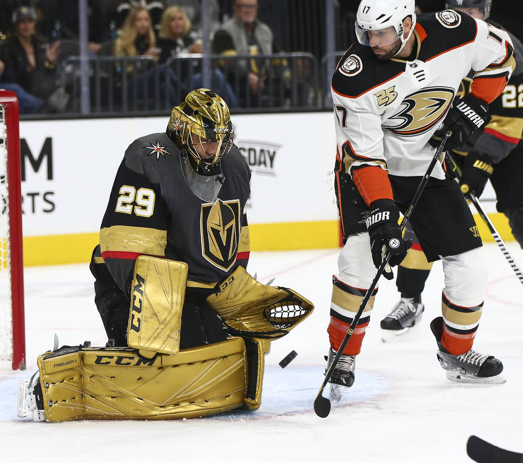 Golden Knights goaltender Marc-Andre Fleury (29) defends the net after losing his stick in front of Anaheim Ducks center Ryan Kesler (17) during the second period of an NHL hockey game at T-Mobile ...