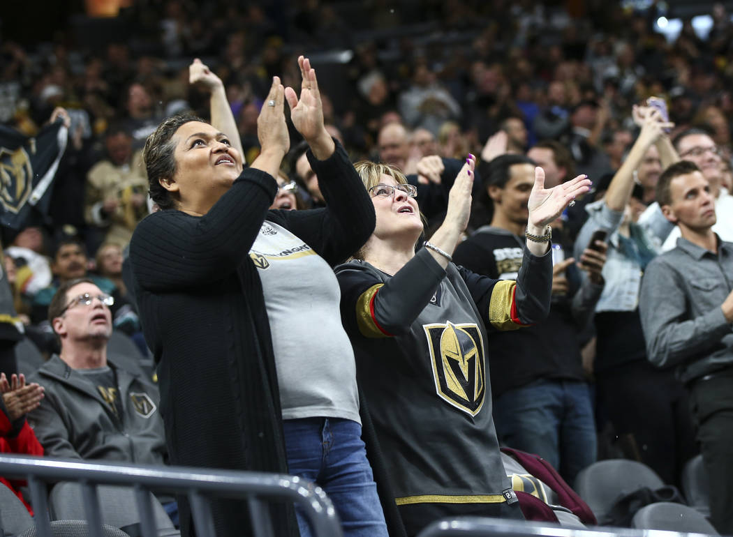 Golden Knights fans celebrate a goal by Golden Knights center Cody Eakin, not pictured, at the start of the second period of an NHL hockey game at T-Mobile Arena in Las Vegas on Wednesday, Nov. 14 ...