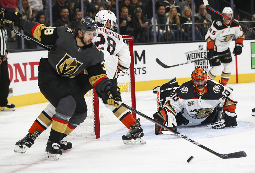 Golden Knights right wing Tomas Hyka (38) goes after the puck as Anaheim Ducks goaltender Ryan Miller (30) looks on during the third period of an NHL hockey game at T-Mobile Arena in Las Vegas on ...