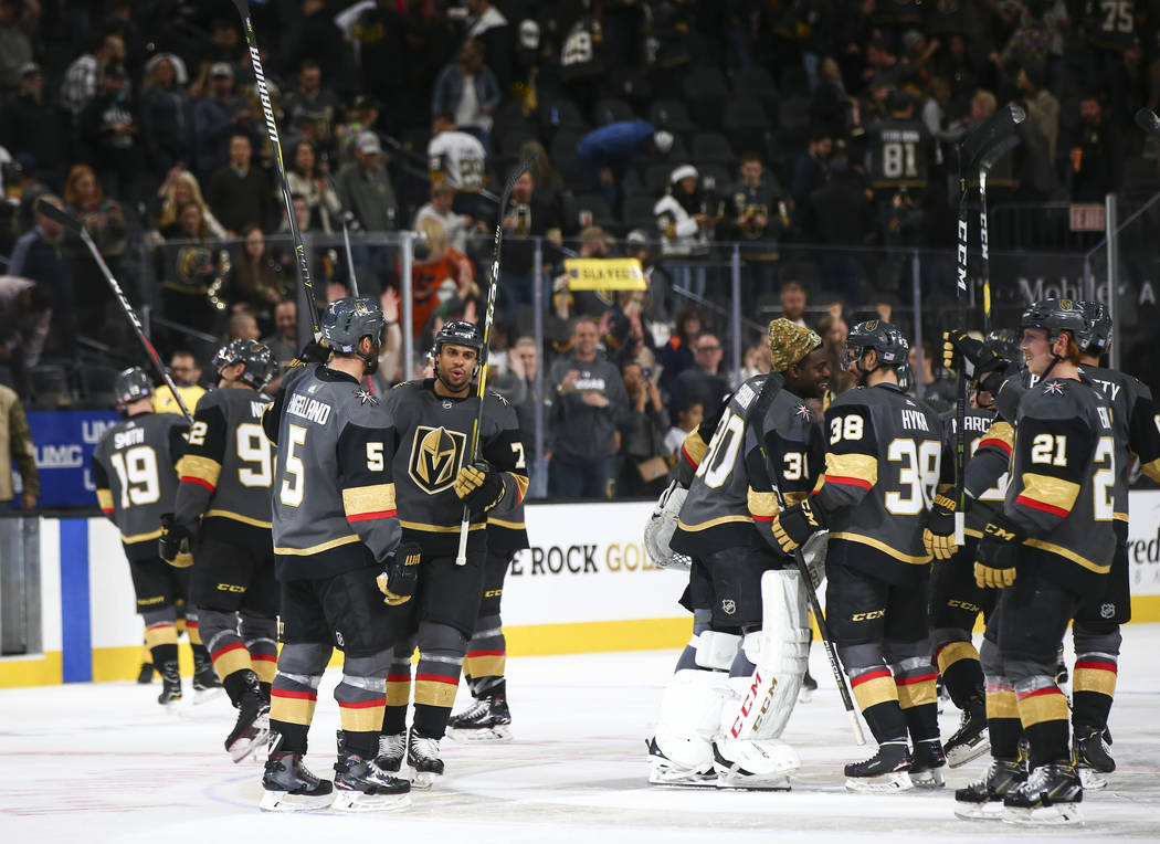 Golden Knights players celebrate their 5-0 victory over the Anaheim Ducks in an NHL hockey game at T-Mobile Arena in Las Vegas on Wednesday, Nov. 14, 2018. Chase Stevens Las Vegas Review-Journal @ ...