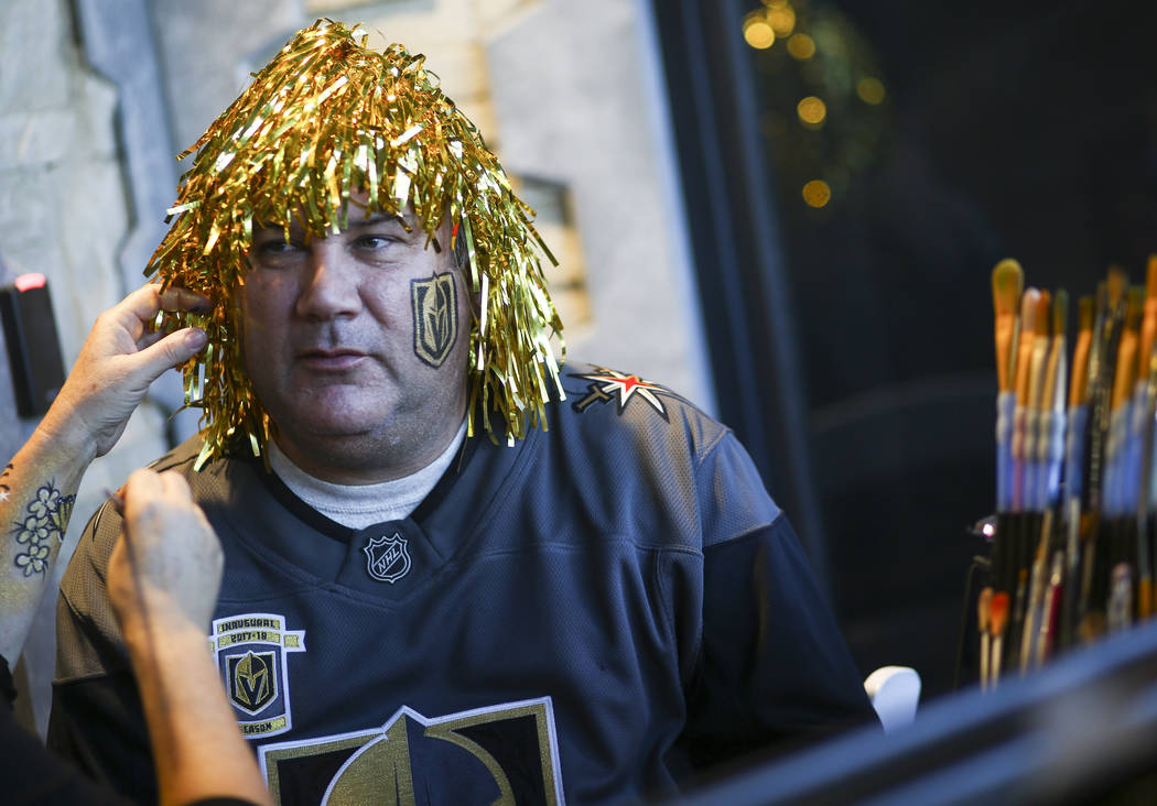 Bill Donaldson of Henderson gets his face painted during the second annual 