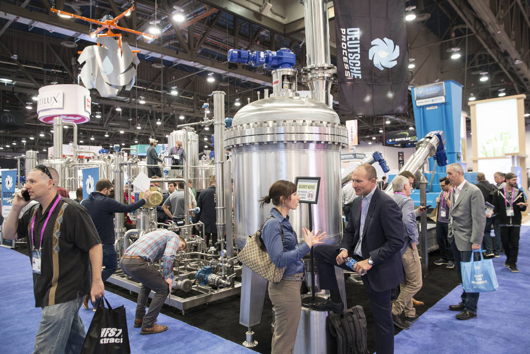 Attendees pass by the Deutsche Process booth during MJBizCon on Wednesday, November 14, 2018, at the Las Vegas Convention Center, in Las Vegas. Benjamin Hager Las Vegas Review-Journal
