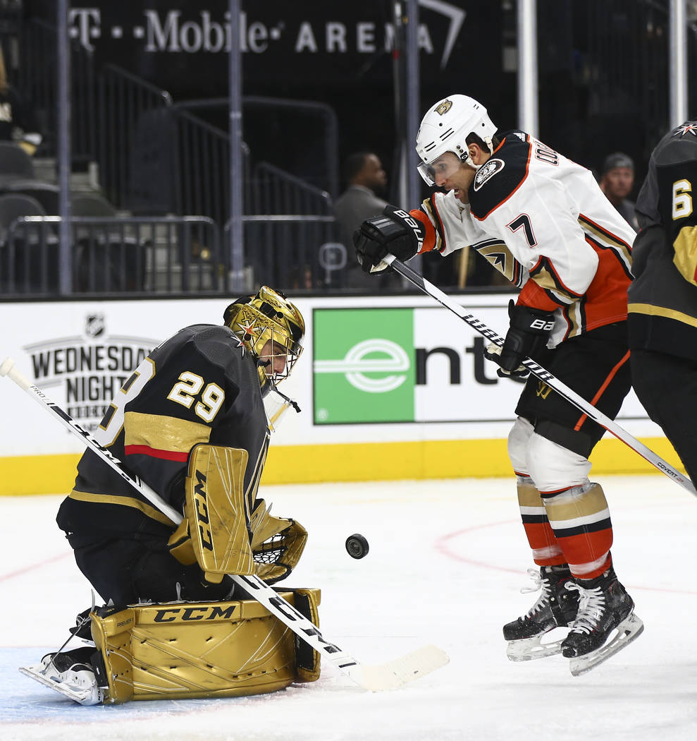 Golden Knights goaltender Marc-Andre Fleury (29) blocks a shot in front of Anaheim Ducks left wing Andrew Cogliano (7) during the second period of an NHL hockey game at T-Mobile Arena in Las Vegas ...
