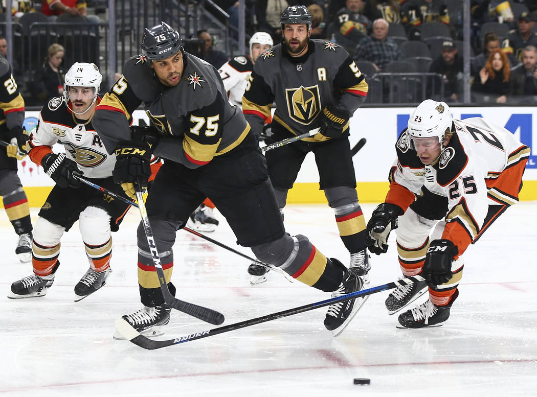 Golden Knights right wing Ryan Reaves (75) and Anaheim Ducks right wing Ondrej Kase (25) chase after the puck during the second period of an NHL hockey game at T-Mobile Arena in Las Vegas on Wedne ...