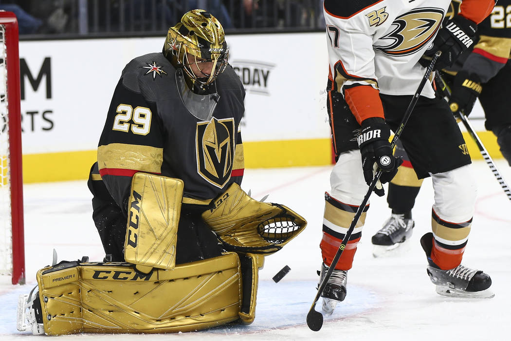 Golden Knights goaltender Marc-Andre Fleury (29) defends the net after losing his stick in front of Anaheim Ducks center Ryan Kesler (17) during the second period of an NHL hockey game at T-Mobile ...