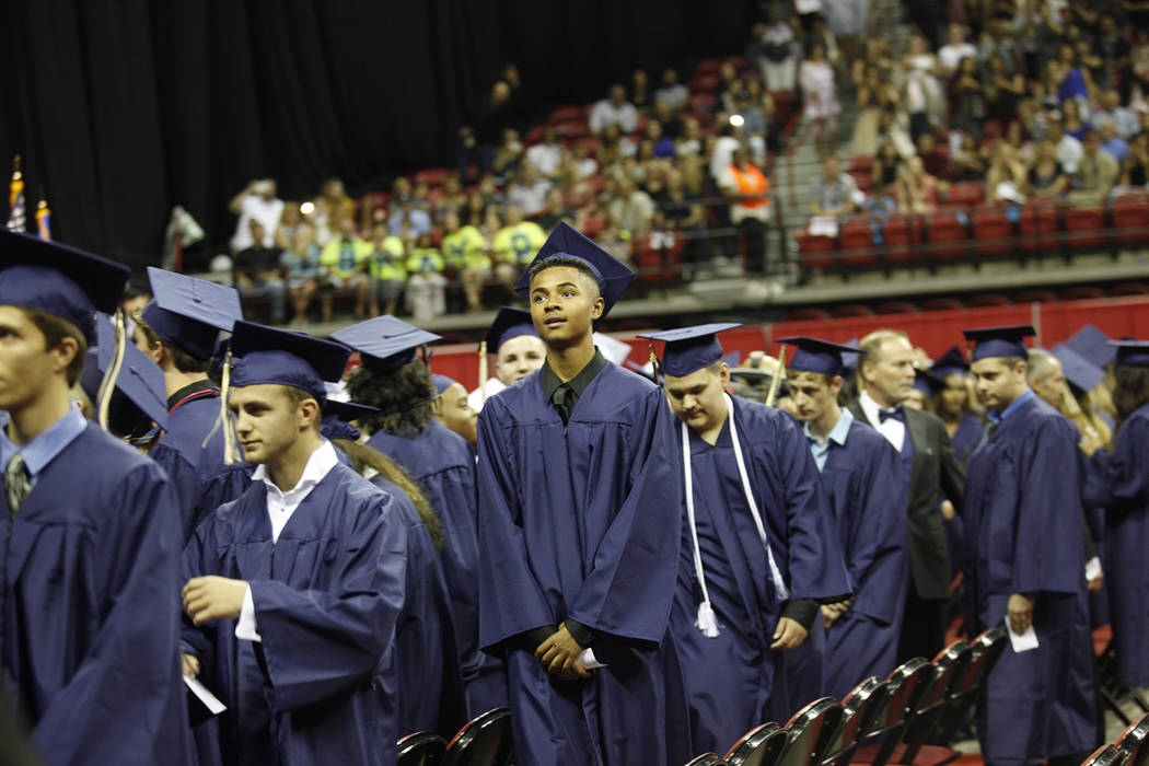 Shadow Ridge High School graduates walk down the aisle on graduation day at the Thomas & Mack Center in Las Vegas, Thursday, May 24, 2018. (Rachel Aston Las Vegas Review-Journal) @rookie__rae