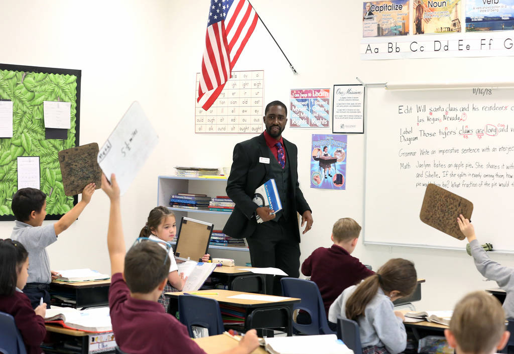 Manuel Mathis, a 2nd-grade teacher at Challenger School-Silverado campus, teaches math on Friday, Nov. 16, 2018, in Las Vegas. Mathis won a national Crayola crayons contest, based on a student nom ...
