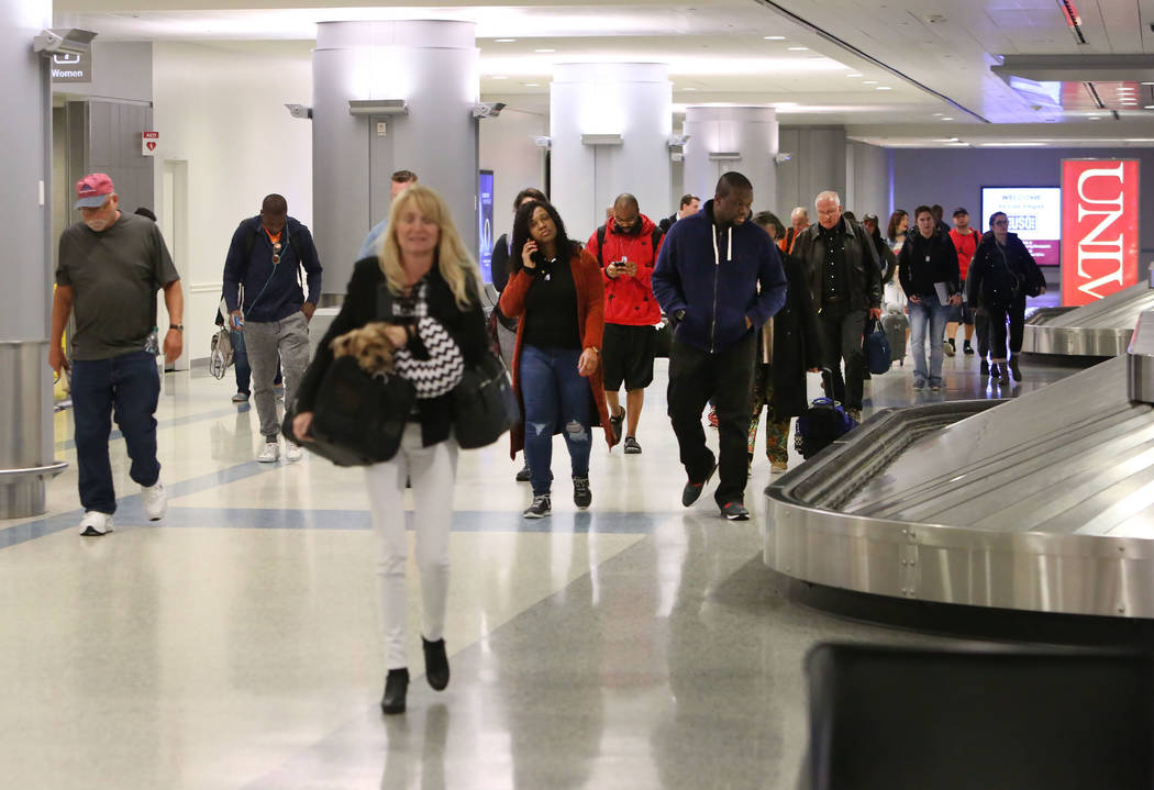 Passengers arrive at Terminal-3 baggage claim area at McCarran International Airport on Wednesday, Feb. 28, 2018, in Las Vegas. (Bizuayehu Tesfaye/Las Vegas Review-Journal) @bizutesfaye