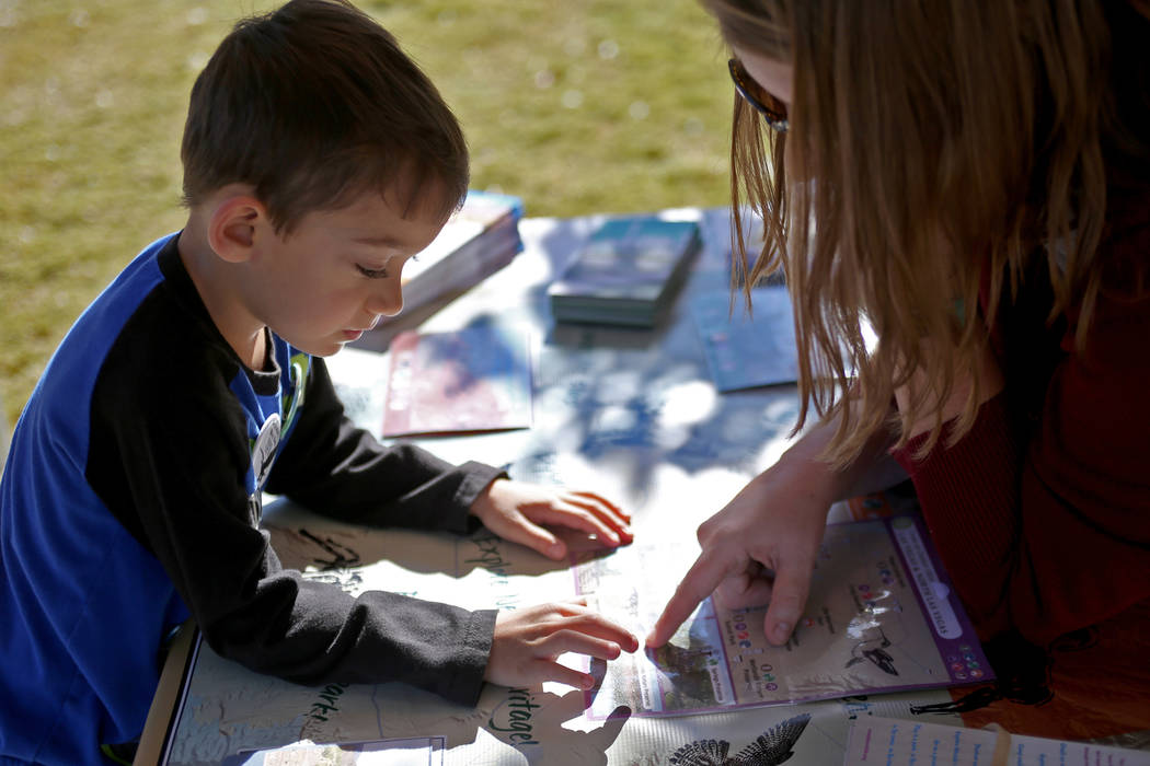 Ben Egosi, 4, learns about hiking and other outdoor activities at the Get Outdoors Nevada booth at Migratory Bird Day at Sunset Park in Las Vegas, Sunday, Nov. 18, 2018. Different organizations of ...