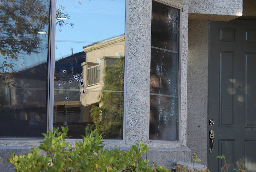Bullet holes mark the windows of a house in the 6700 block of Courtney Michelle Street in North Las Vegas that was hit by gunfire, killing an 11-year-old girl on Thursday night, Nov. 1, 2018. (Max ...