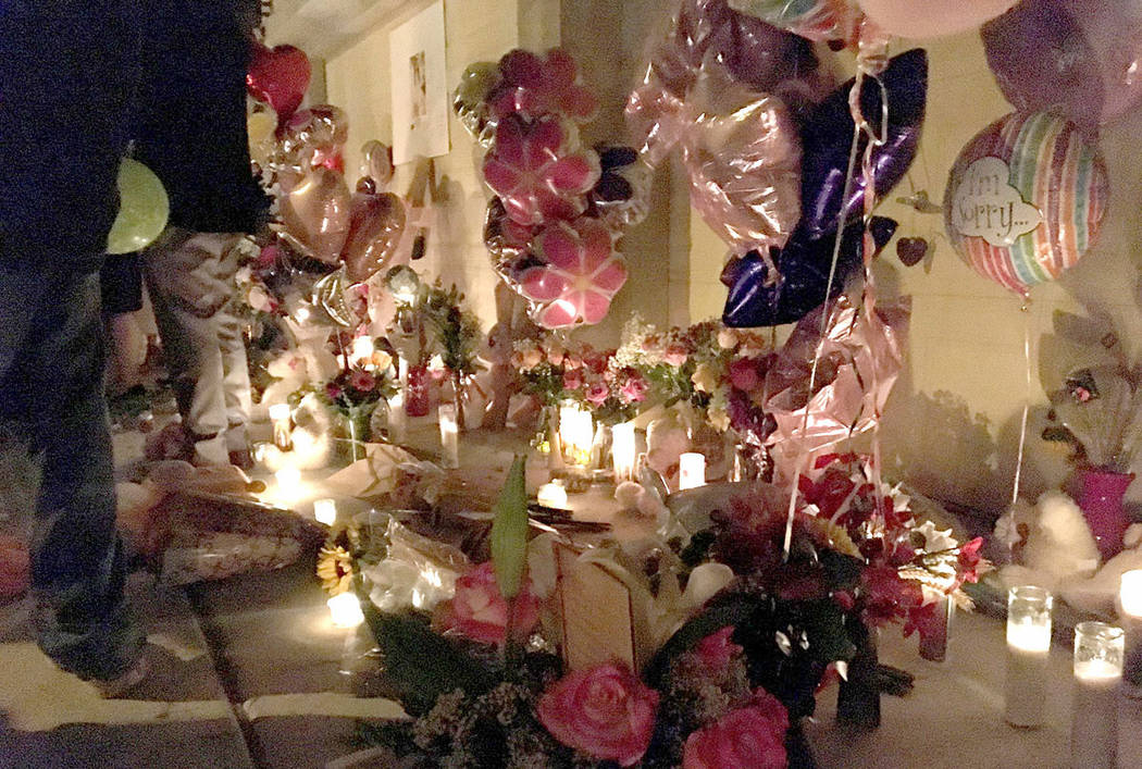 Mourners gather to remember Angelina Erives during a vigil Saturday, Nov. 3, 2018, on Courtney Michelle Street in Las Vegas. (Kimber Laux/Las Vegas Review-Journal)