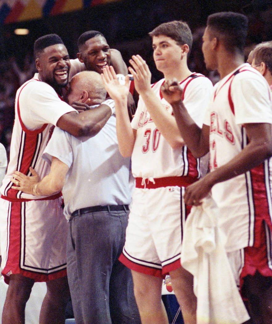 UNLV basketball players celebrate with head coach Jerry Tarkanian after their NCAA National Championship win over the Duke Blue Devils on April 2, 1990. (Review-Journal File)
