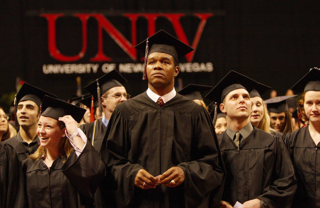 Randall Cunningham, who spent 16 seasons in the NFL as a quarterback with Philadephia, Minnesota, Baltimore, and Dallas, stands with other UNLV graduates at the Thomas & Mack Center in Las Veg ...