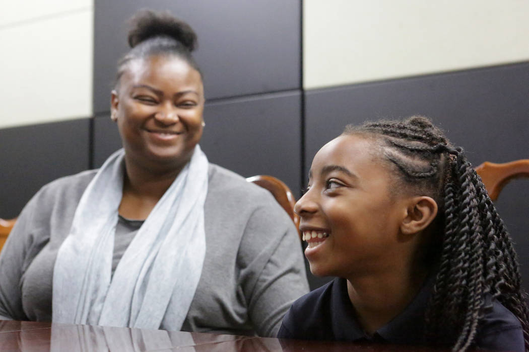 Suddenly Crosby, left, smiles with her daughter Jaraya, 7, at Mountain View Christian School in Las Vegas on Friday, Nov. 16, 2018. The Opportunity Scholarship program helped Crosby attend the sch ...