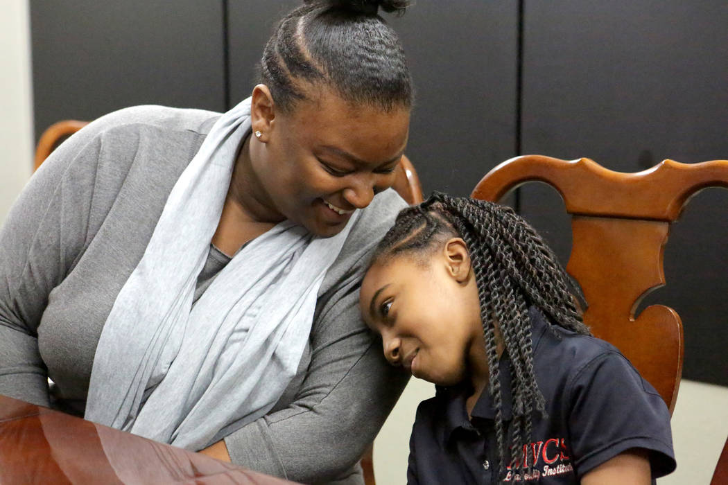 Suddenly Crosby, left, talks with her daughter Jaraya, 7, at Mountain View Christian School in Las Vegas on Friday, Nov. 16, 2018. The Opportunity Scholarship program helped Crosby attend the scho ...