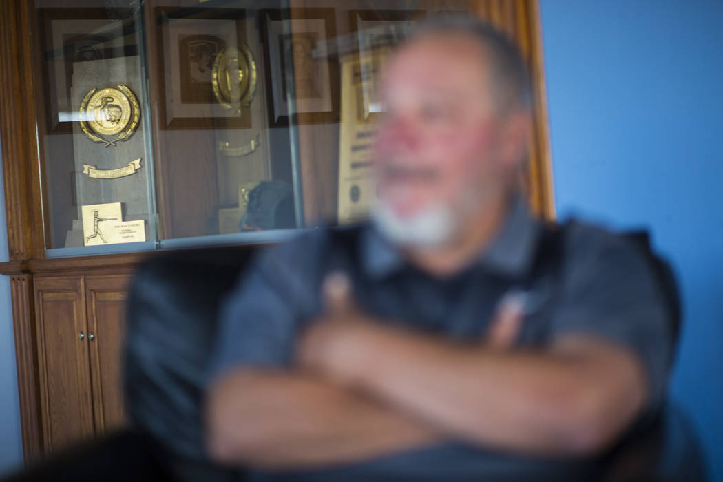 A variety of trophies, including four national championships, behind head coach Rick Vanderhook in the Cal State Fullerton baseball team clubhouse in Fullerton, Calif. on Wednesday, Oct. 31, 2018. ...