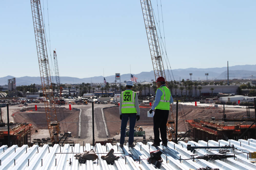 Don Webb, left, chief operating officer of the LV Stadium Co., with Rick Velotta, reporter for the Las Vegas Review-Journal, gives a tour of a Raiders stadium construction site in Las Vegas Monday ...