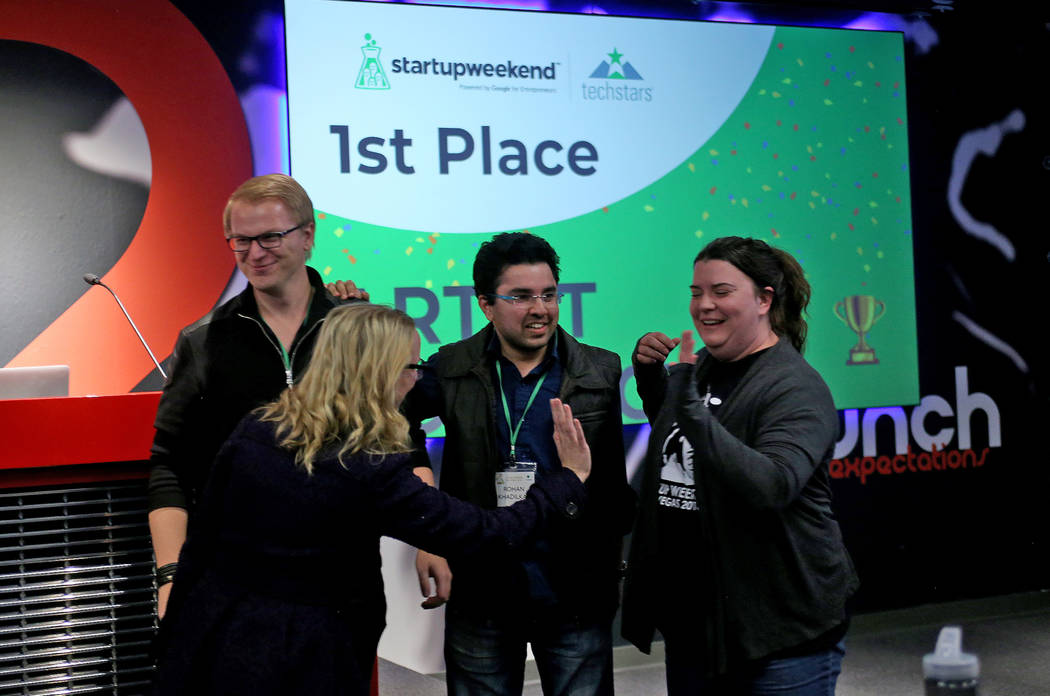 Members of the team Artist Connect celebrate after winning first place at the 2018 Techstars Startup Weekend at Rob Roy's Innevation Center in Las Vegas, Sunday, Nov. 18, 2018. With the help of en ...