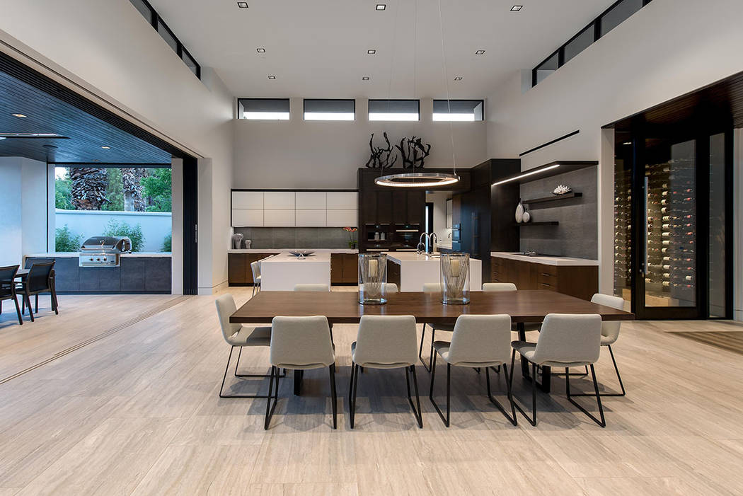 The dining room opens to an outdoor kitchen. (Studio g Architecture)