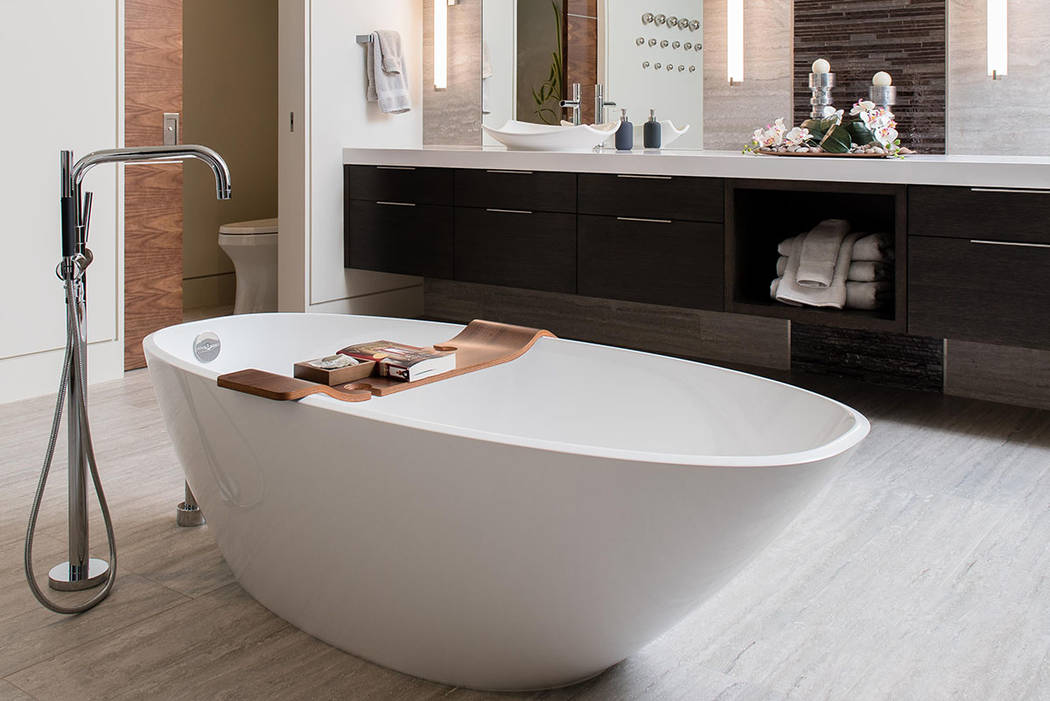 The master bath is anchored with a large soaking tub. (Studio g Architecture)