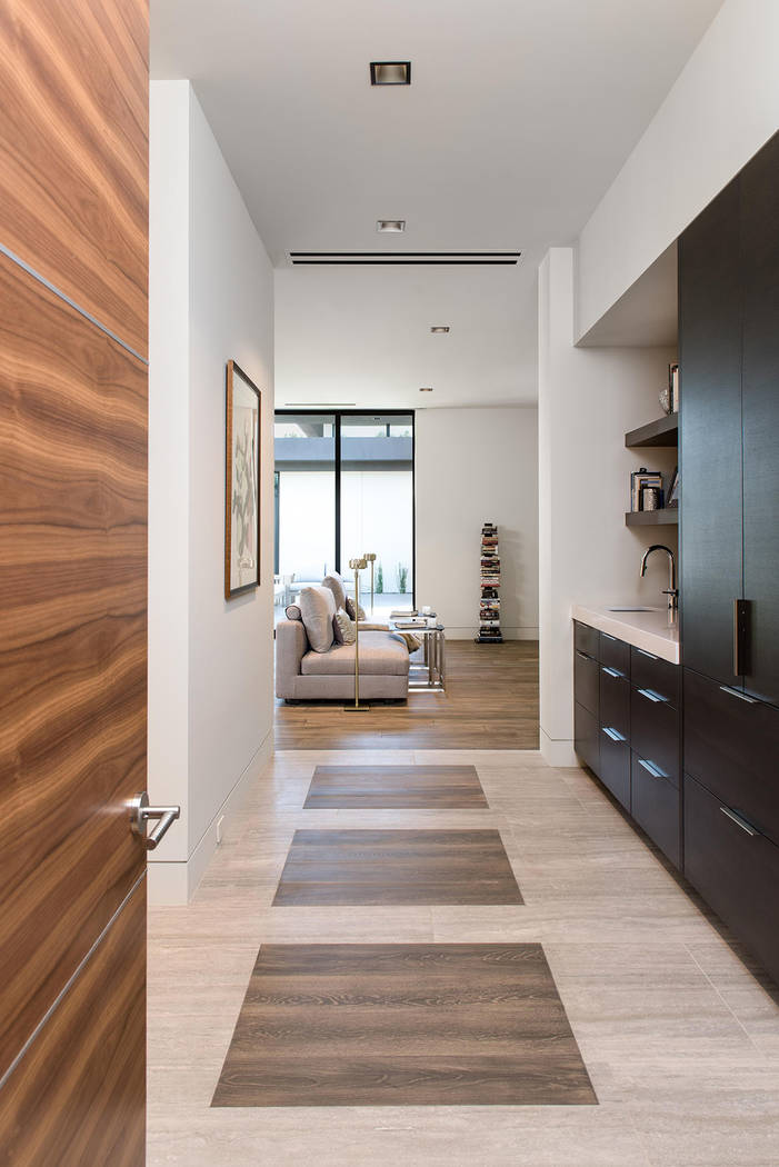 A hallway leads to the master bedroom. (Studio g Architecture)