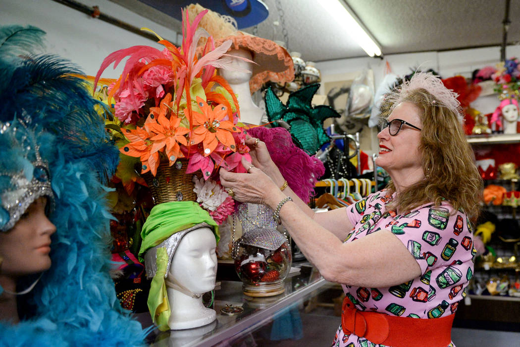 Co-owner Sarah Collins spruces up a costume display inside Main Street Peddler Antique Mall in Las Vegas, Wednesday, Nov. 21, 2018. Caroline Brehman/Las Vegas Review-Journal