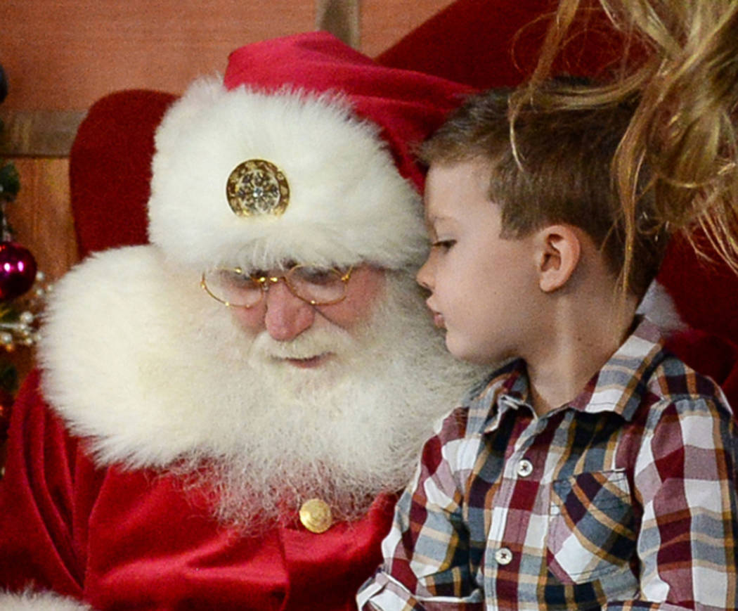Maverick Willis, 5, from Henderson, sits on Santa Claus' lap at the District at Green Valley Ranch in Henderson, Saturday, Nov. 24, 2018. Caroline Brehman/Las Vegas Review-Journal