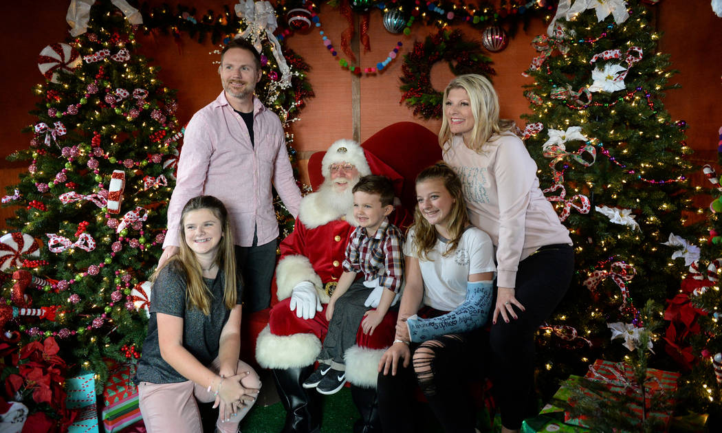 The Willis family poses for a photograph with Santa Claus at the District at Green Valley Ranch in Henderson, Saturday, Nov. 24, 2018. Caroline Brehman/Las Vegas Review-Journal