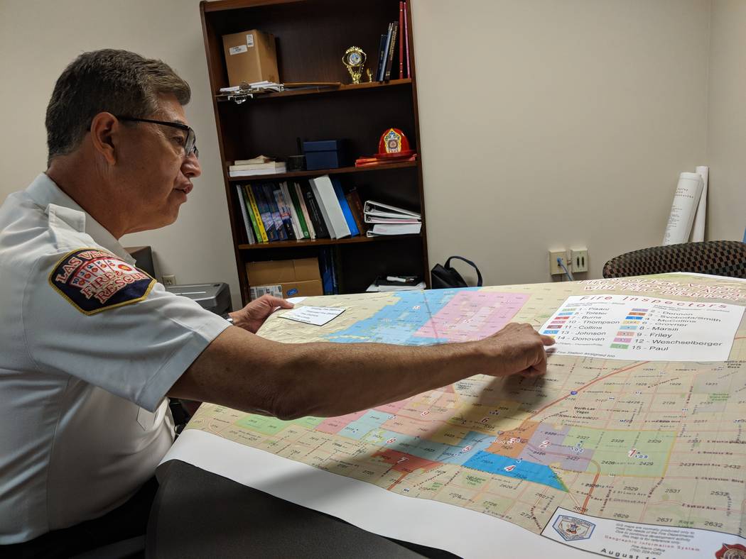 Las Vegas Fire Marshal/Assistant Chief Robert Nolan looks over a map that shows the city of Las Vegas fire inspector coverage area, in his office on Thursday, Aug. 16, 2018. Jamie Munks, Las Vegas ...