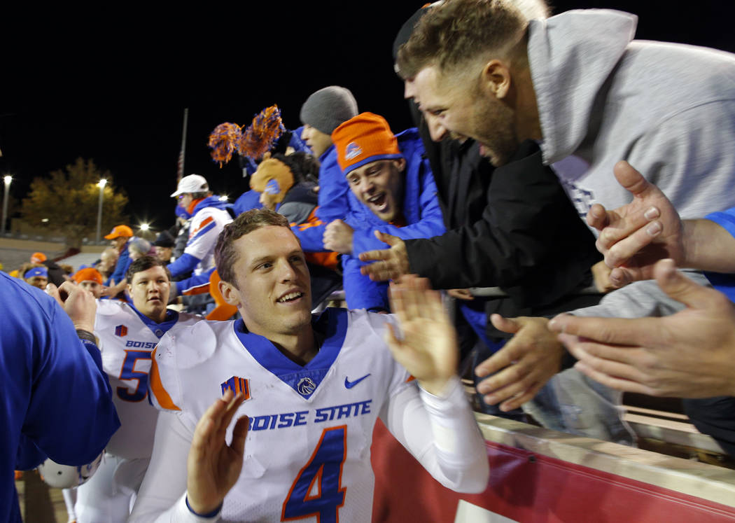 Boise State quarterback Brett Rypien (4) is congratulated by fans after Boise State defeated New Mexico 45-14 in an NCAA college football game in Albuquerque, N.M., Friday, Nov. 16, 2018. (AP Phot ...