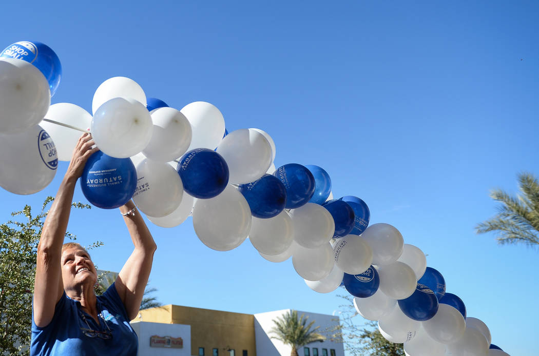 Imaginations owner Michele Walker sets up a ballon arc outside of her business during Shop Small Henderson in Henderson, Saturday, Nov. 24, 2018. Caroline Brehman/Las Vegas Review-Journal