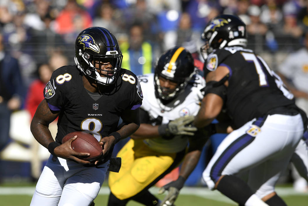 Baltimore Ravens quarterback Lamar Jackson (8) rushes the ball in the first half of an NFL football game against the Pittsburgh Steelers, Sunday, Nov. 4, 2018, in Baltimore. (AP Photo/Nick Wass)