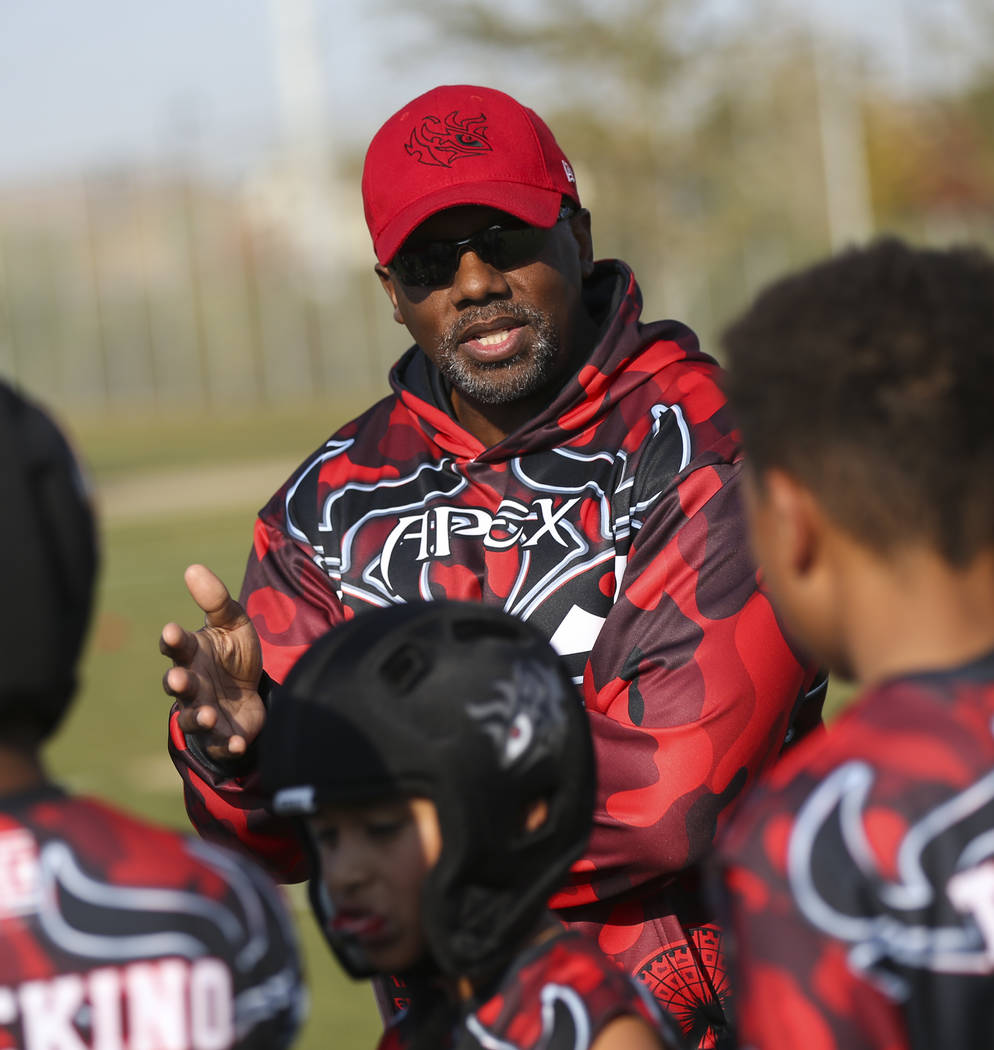 Apex Predators head coach Omar Smith talks with his team at halftime during a National Youth Sports Nevada flag football game at Aventura Park in Henderson on Saturday, Nov. 17, 2018. Chase Steven ...