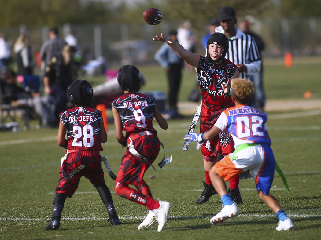 Apex Predators' Vincent Hales (4) throws a pass while playing against the Ballers during a National Youth Sports Nevada flag football game at Aventura Park in Henderson on Saturday, Nov. 17, 2018. ...