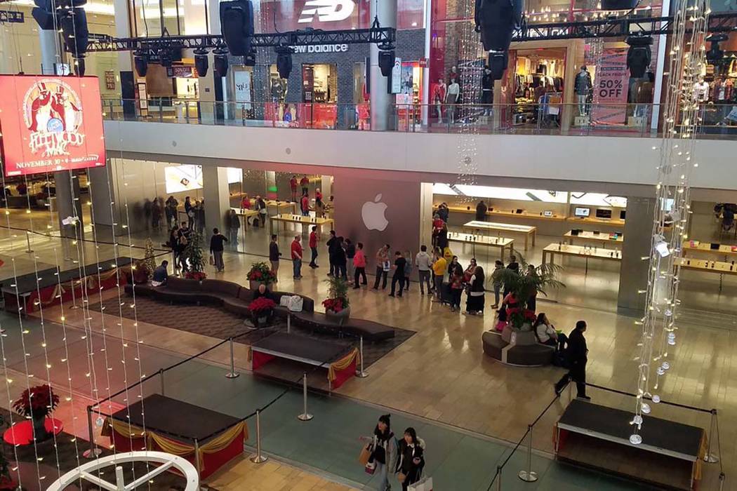 A woman entering the Apple Store, Fashion Show Mall, Las Vegas USA