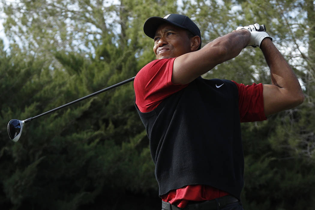Tiger Woods hits off the second tee during a golf match against Phil Mickelson at Shadow Creek golf course, Friday, Nov. 23, 2018, in Las Vegas. (AP Photo/John Locher)