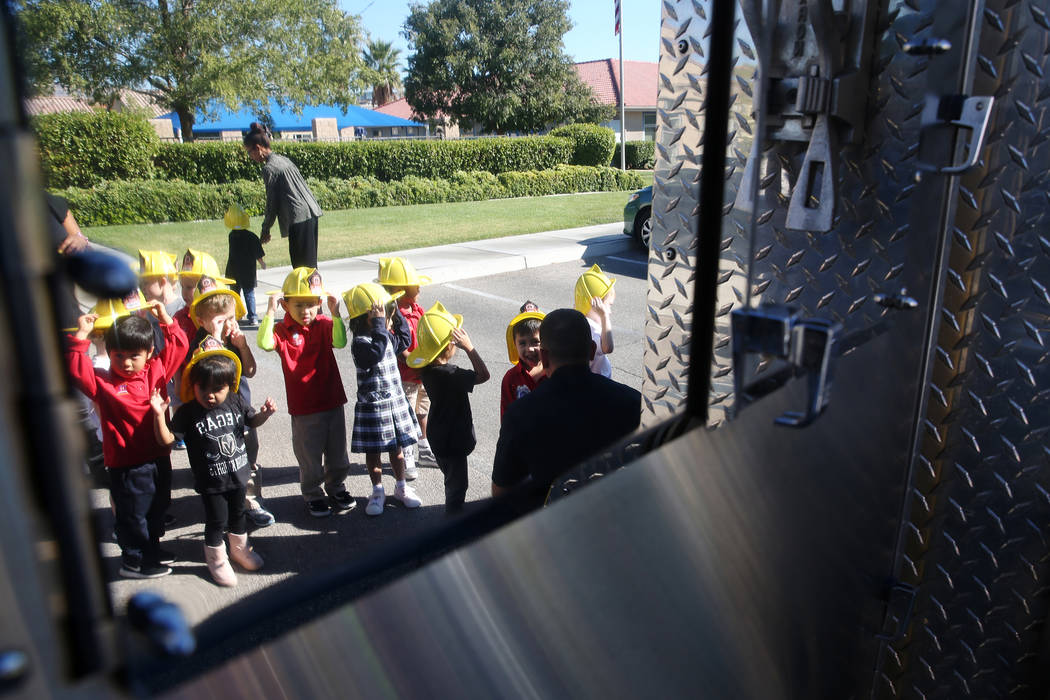 Children wait in line to see a Clark County Fire Department engine at Merryhill Preschool, 5055 S. Durango Dr., in Las Vegas, Wednesday, Oct. 24, 2018. Erik Verduzco Las Vegas Review-Journal @Erik ...