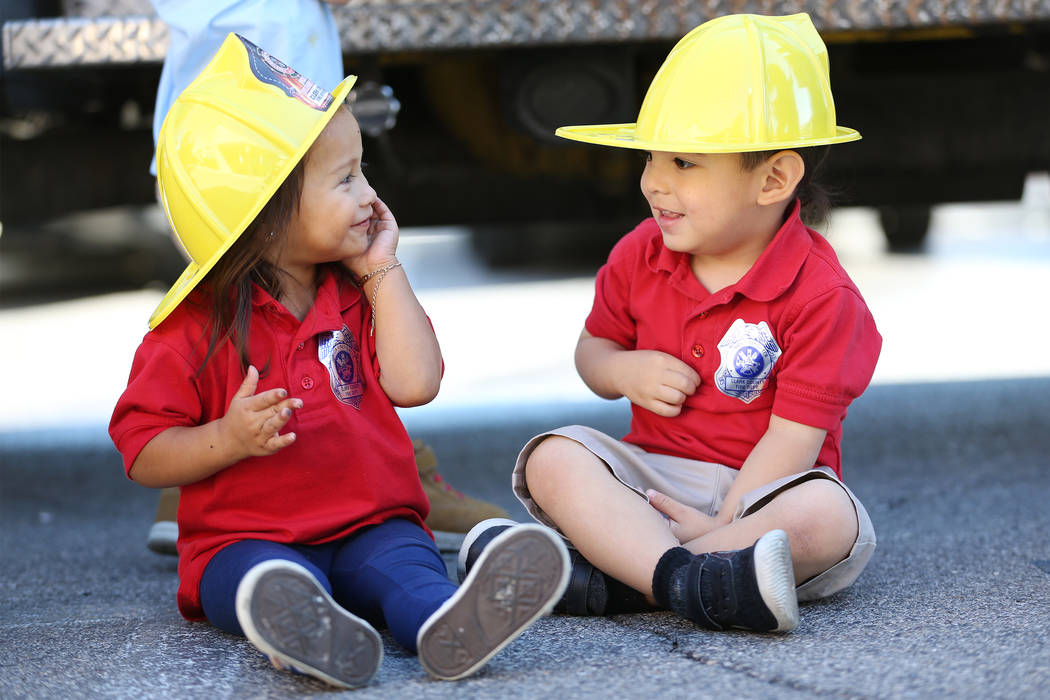 Aliyanna Lemos, 2, left, with Samuel De La Cruz, 2, during a fire awareness visit by Clark County Fire Department to Merryhill Preschool, 5055 S. Durango Dr., in Las Vegas, Wednesday, Oct. 24, 201 ...