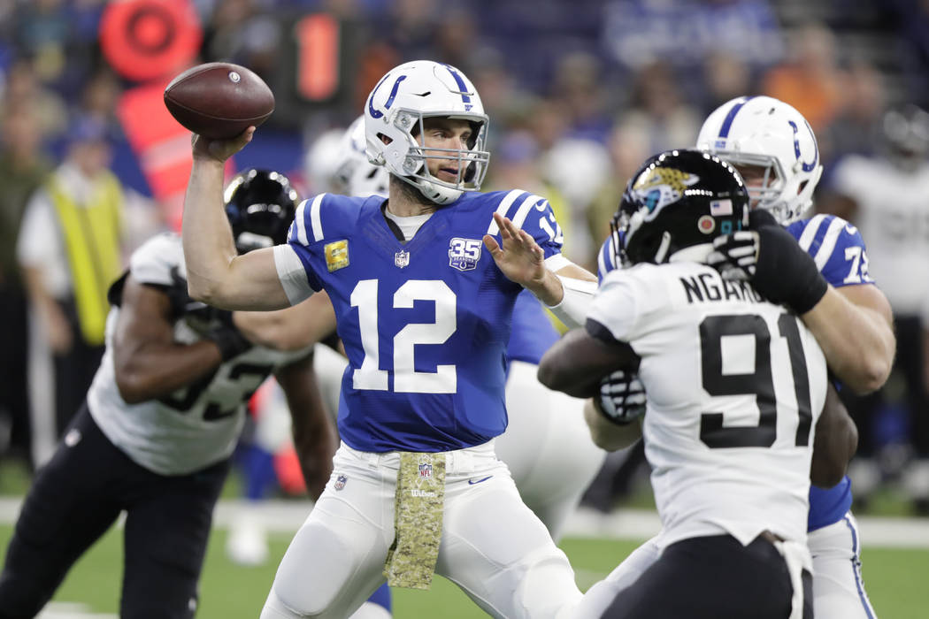 Indianapolis Colts quarterback Andrew Luck (12) throws against the Jacksonville Jaguars during the first half of an NFL football game in Indianapolis, Sunday, Nov. 11, 2018. (AP Photo/Michael Conroy)