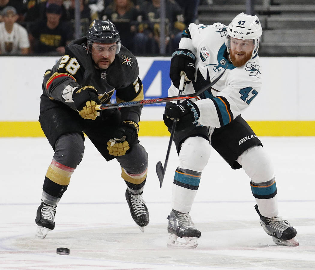 San Jose Sharks defenseman Joakim Ryan (47) passes the puck past Vegas Golden Knights left wing William Carrier (28) during the first period of an NHL hockey game Saturday, Nov. 24, 2018, in Las V ...