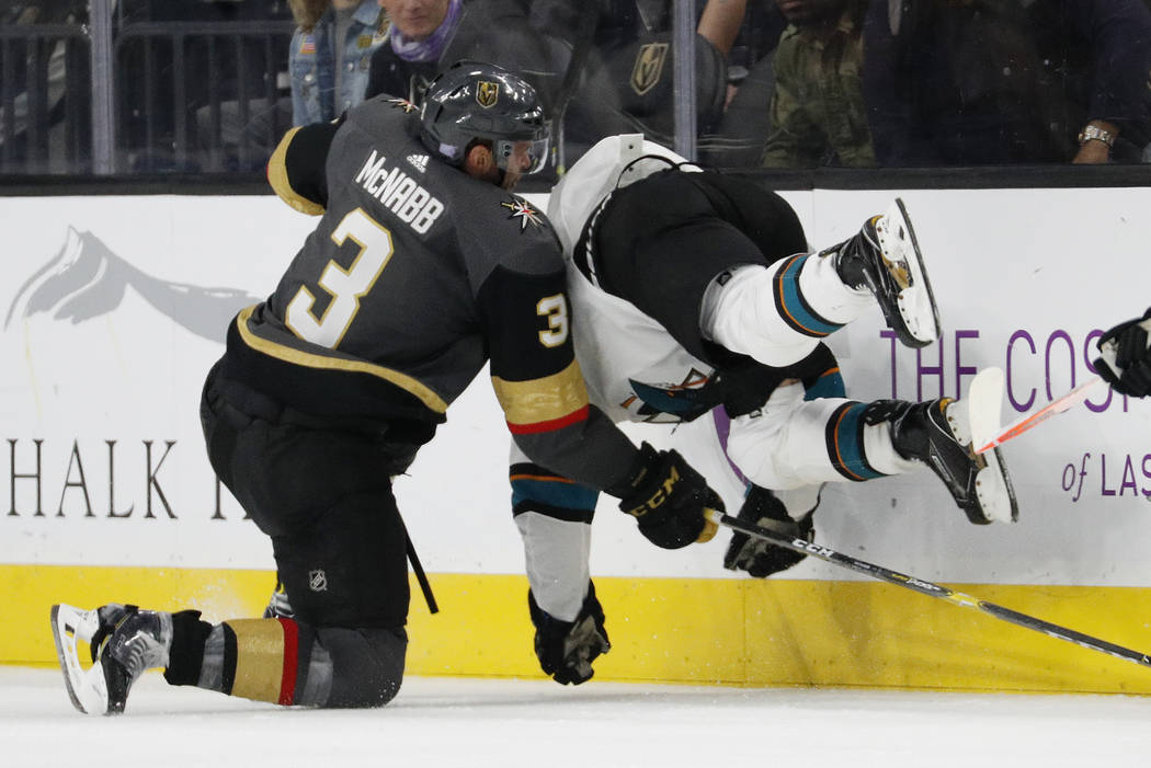 Vegas Golden Knights defenseman Brayden McNabb (3) checks San Jose Sharks right wing Joonas Donskoi (27) during the second period of an NHL hockey game Saturday, Nov. 24, 2018, in Las Vegas. (AP P ...