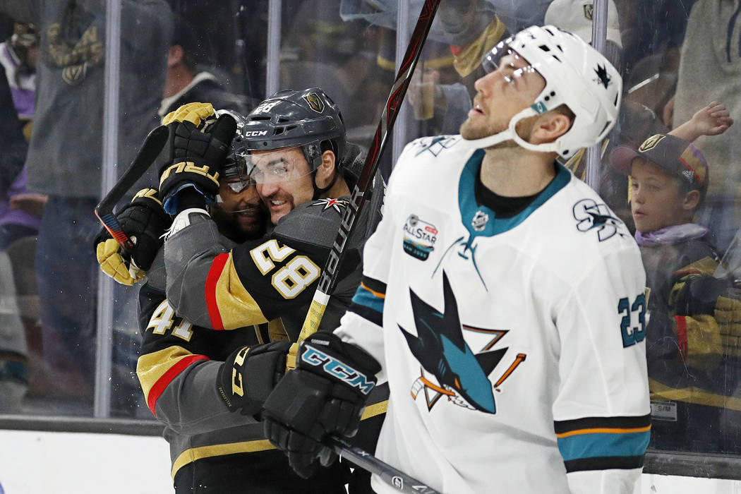 Vegas Golden Knights center Pierre-Edouard Bellemare, celebrates after left wing William Carrier (28) scored against the San Jose Sharks during the second period of an NHL hockey game Saturday, No ...