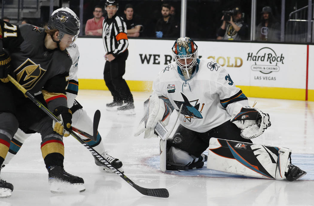 San Jose Sharks goaltender Aaron Dell (30) makes a save against the Vegas Golden Knights during the second period of an NHL hockey game Saturday, Nov. 24, 2018, in Las Vegas. (AP Photo/John Locher)