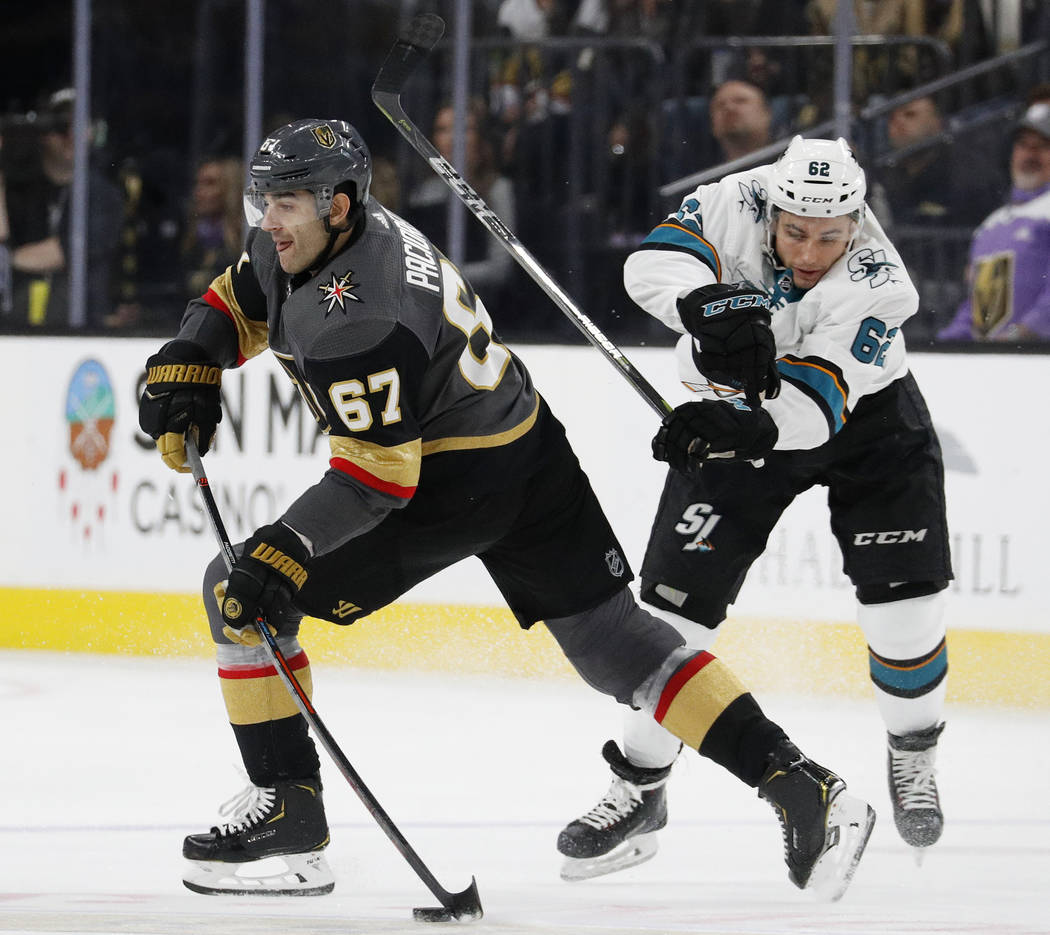 Vegas Golden Knights left wing Max Pacioretty (67) passes the puck as San Jose Sharks right wing Kevin Labanc defends during the third period of an NHL hockey game Saturday, Nov. 24, 2018, in Las ...