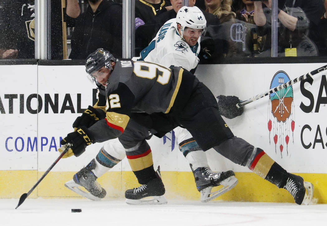 Vegas Golden Knights left wing Tomas Nosek (92) vies for the puck with San Jose Sharks defenseman Marc-Edouard Vlasic (44) during the third period of an NHL hockey game Saturday, Nov. 24, 2018, in ...