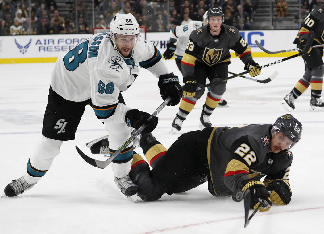 San Jose Sharks center Melker Karlsson (68) and Vegas Golden Knights defenseman Nick Holden (22) vie for the puck during the first period of an NHL hockey game Saturday, Nov. 24, 2018, in Las Vega ...
