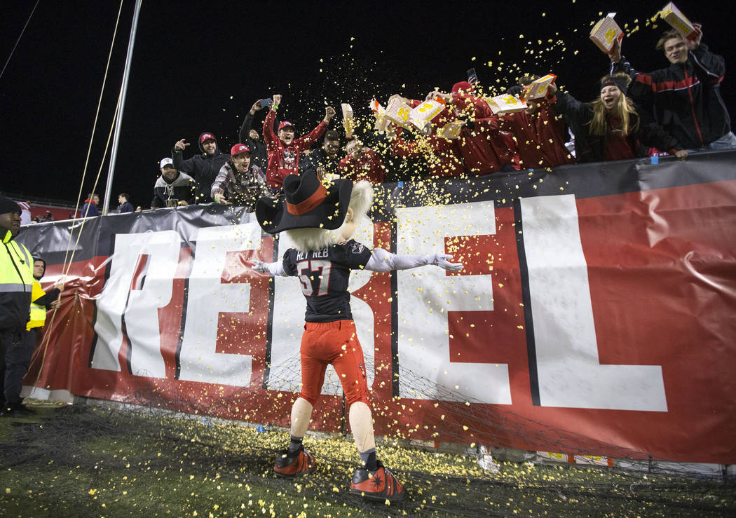 UNLV Rebels mascot Hey Reb! gets covered in popcorn by fans after Rebels quarterback Armani Rogers scored a touchdown against the Nevada Wolf Pack during the second half of an NCAA football game a ...
