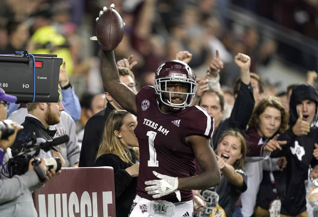 Texas A&M wide receiver Quartney Davis (1) celebrates after catching a touchdown pass during the seventh overtime of an NCAA college football game against LSU Saturday, Nov. 24, 2018, in Colle ...