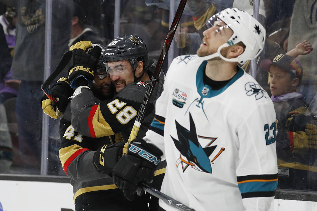 Vegas Golden Knights center Pierre-Edouard Bellemare, celebrates after left wing William Carrier (28) scored against the San Jose Sharks during the second period of an NHL hockey game Saturday, No ...